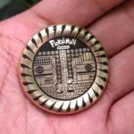 A Pokemon haptic coin Brass Edition